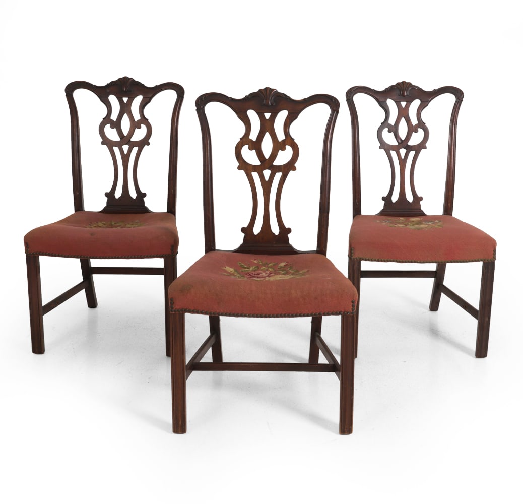 ANTIQUE CHIPPENDALE STYLE MAHOGANY DINING CHAIRS: Carved back with floral needlepoint upholstered seats. Dimensions: H 39.75" x W 21" x D 18.25" Condition: Scuffs, dings, wear of finish, and discoloration. Missing support bars at base. Patina to nail