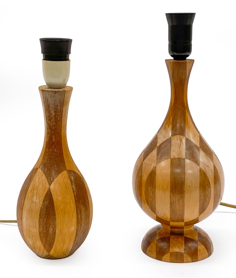 TURNED WOOD TABLE LAMPS C. 1970S: (2) total. Multi-tone wooden inlaid design. Circa 1970s. One weighted with lead base. Dimensions: (Largest) H 13" x W 5" Condition: Wear consistent with age and use. Wiring untested, cord cut. Fading,