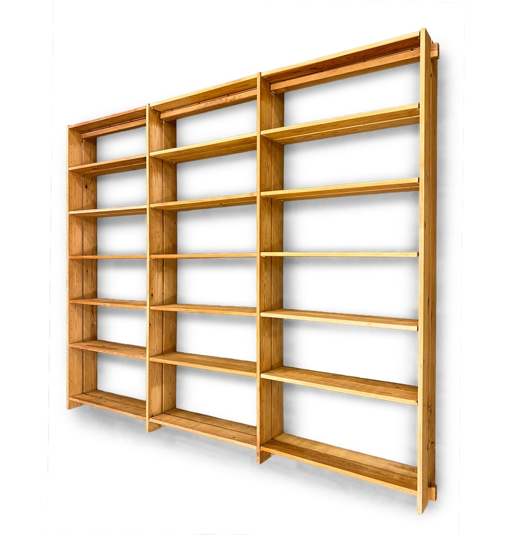SCANDINAVIAN PINE BOOKCASE C. 1970S: Dimensions: H 82" x W 96" x D 9.5" Condition: Wear consistent with age and use. Scuffs, rubs, fading, nicks, some watermarks.