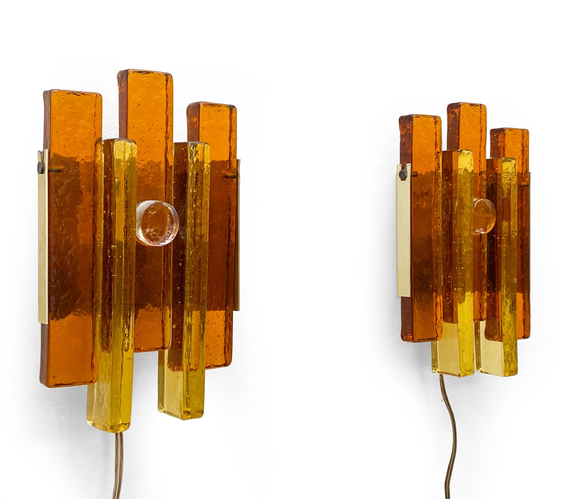 PAIR SVEND AAGE HOLM SORENSEN GLASS WALL SCONCES: For Hassel & Teudt. Brass fitting and colored amber glass prisms. Apparently unmarked. Denmark, circa 1960s. Dimensions: H 8.5" x W 5.25" x D 3.5" Condition: Wear consistent with age and use. Wiring