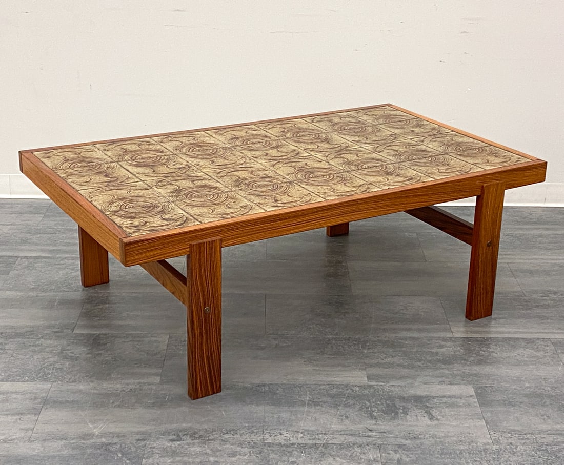 DANISH ROSEWOOD & TILE COFFEE TABLE C. 1960S: Rosewood frame with tile top. Denmark, circa 1960s. Dimensions: H 20.5" x W 58.25" x D 34.5" Condition: Wear consistent with age and use. Scuffs, light rubs, some fading.