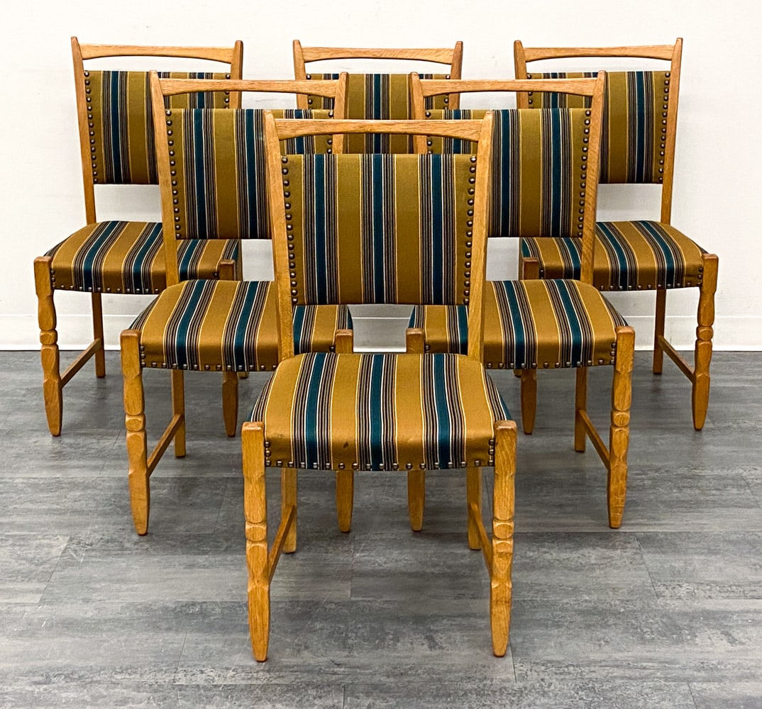 (6) KJAERNULF STYLE DANISH OAK DINING CHAIRS 1970S: Carved oak frame and striped upholstery. Denmark, circa 1970s. Dimensions: H 35" x W 18" x D 19" x SH 18.5" Condition: Wear consistent with age and use. Scuffs, fading, minor soiling, some discolorati