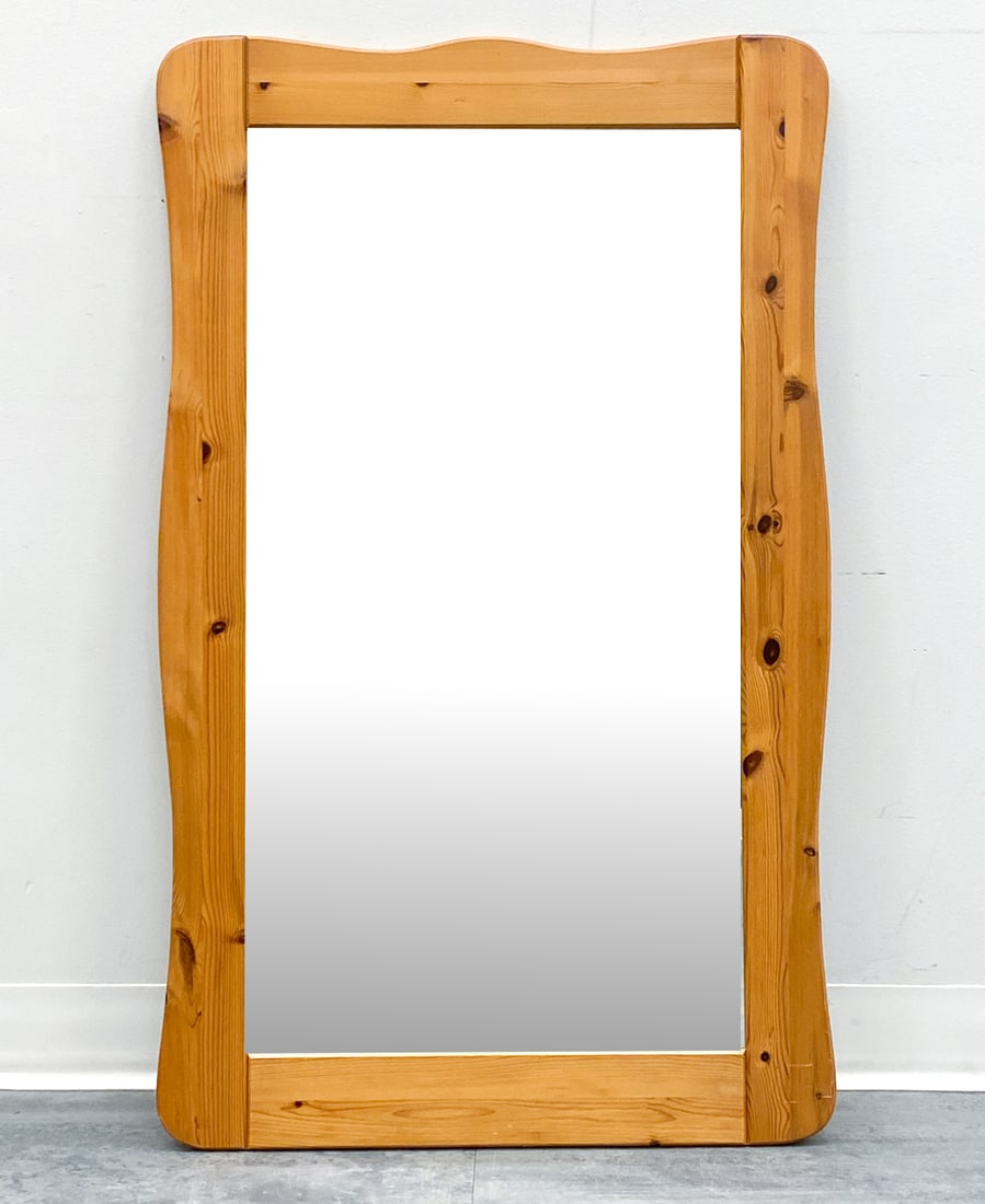 SWEDISH PINE WALL MIRROR C. 1970S: Dimensions: H 41" x W 25" Condition: Wear consistent with age and use. Scuffs, minor fading to corners.