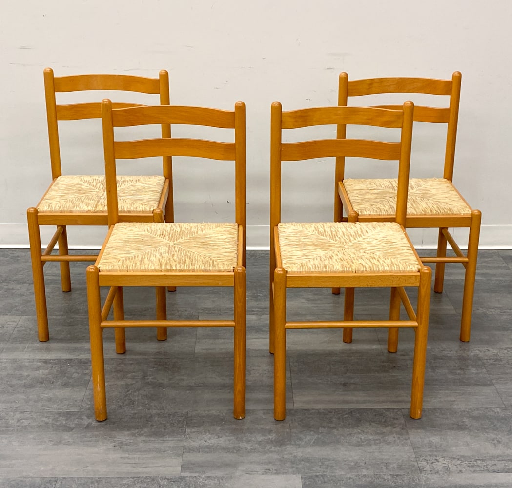 (4) DANISH BEECH & RUSH DINING CHAIRS C. 1960S: Woven rush seat and ladder back dining chairs. Denmark, circa 1960s. Dimensions: H 32.5" x W 16.25" x D 16" x SH 18" Condition: Wear consistent with age and use. Rubs, scuffs, soiling, fading. Discolo