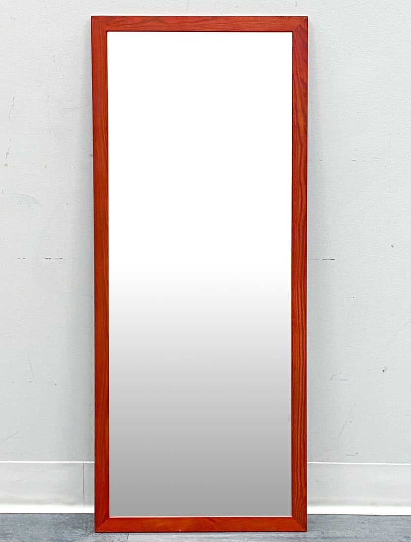 SCANDINAVIAN PINE WALL MIRROR C. 1970S: Stained pine frame. Scandinavian, circa 1970s. Dimensions: H 39" x W 16.25" Condition: Wear consistent with age and use. Minor scuffs.