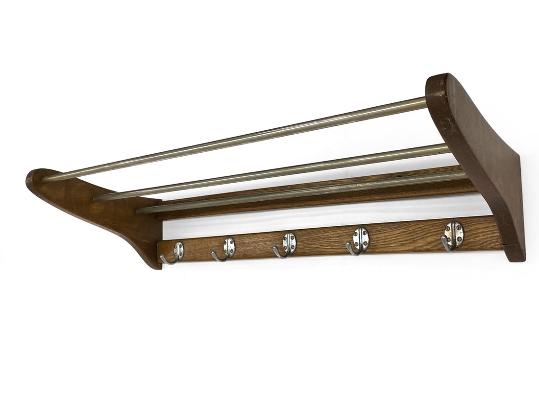 SCANDINAVIAN OAK WALL COAT RACK C. 1960S: Dimensions: H 6" x W 39.75" x D 12" Condition: Wear consistent with age and use. Stress crack. Some scuffs, soiling, watermarks, discoloration, and fading.