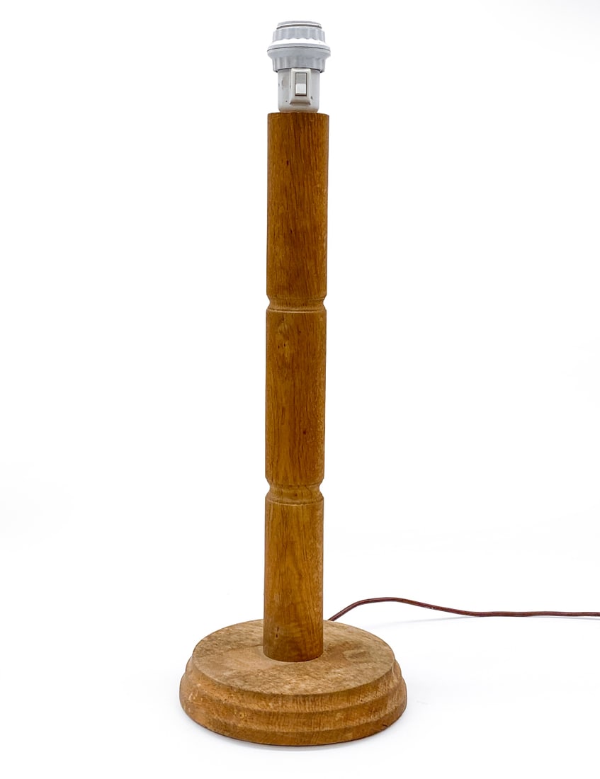 SCANDINAVIAN OAK TABLE LAMP C. 1960S: Dimensions: H 25" x Dia 9" Condition: Wear consistent with age and use. Wiring untested, cord cut. Fading, scuffs, watermarks, finish loss to base.