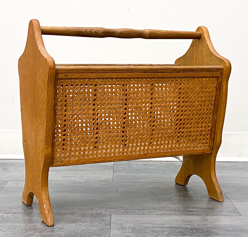 SCANDINAVIAN OAK & CANE MAGAZINE RACK C. 1970S: Dimensions: H 17.5" x W 18.5" x D 9.5" Condition: Wear consistent with age and use. Scuffs, soiling, minor fading.