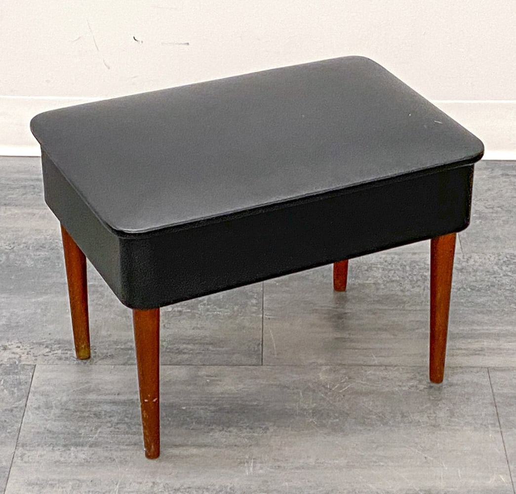 DANISH TEAK & LEATHER OTTOMAN C. 1960S: Ottoman with storage underneath the seat. Denmark, circa 1960s. Dimensions: H 14" x W 19" x D 13" Condition: Wear consistent with age and use. Nicks, scuffs, rubs, light scratches.