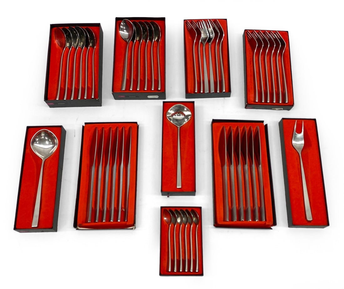 TIAS ECKHOFF STAINLESS STEEL FLATWARE GROUPING: "Fuga" pattern designed by Norwegian industrial designer Tias Eckhoff for Danish company Lundtofte. Marked to lid. Includes: (12) forks, (12) knives, (12) spoons, (6) tea spoons, salad fork, (2) large