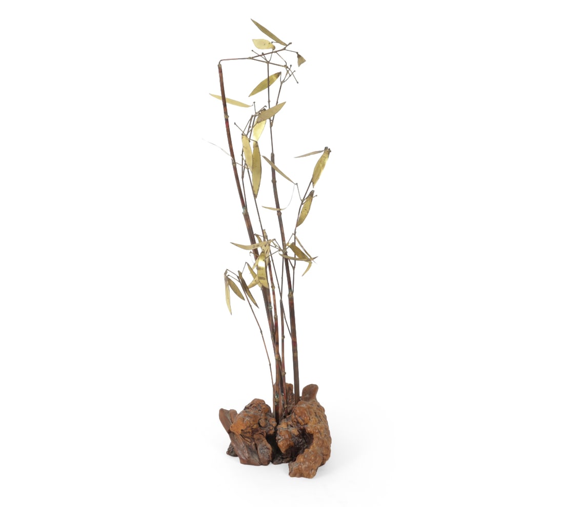 MIXED METAL FAUX BAMBOO SCULPTURE: Brass and copper bamboo form sculpture on a natural wood base. Singed on leaf. C.1979 Dimensions H29 " x W 11 " D" 11 Condition: Missing some leaves. Patina to metal.