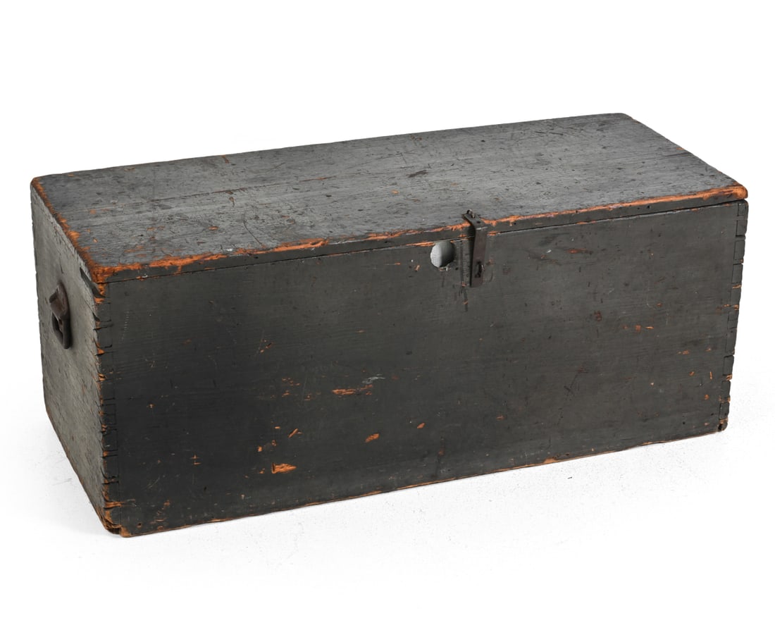 19TH C. PAINTED PINE BLANKET CHEST: Black painted pine with iron handles and latch. 19th century. Dimensions: H 17'' x W 41.25'' x D 17'' Condition: Discoloration, cracked on bottom, and stained. Scuffs. Wear consistent with age and use
