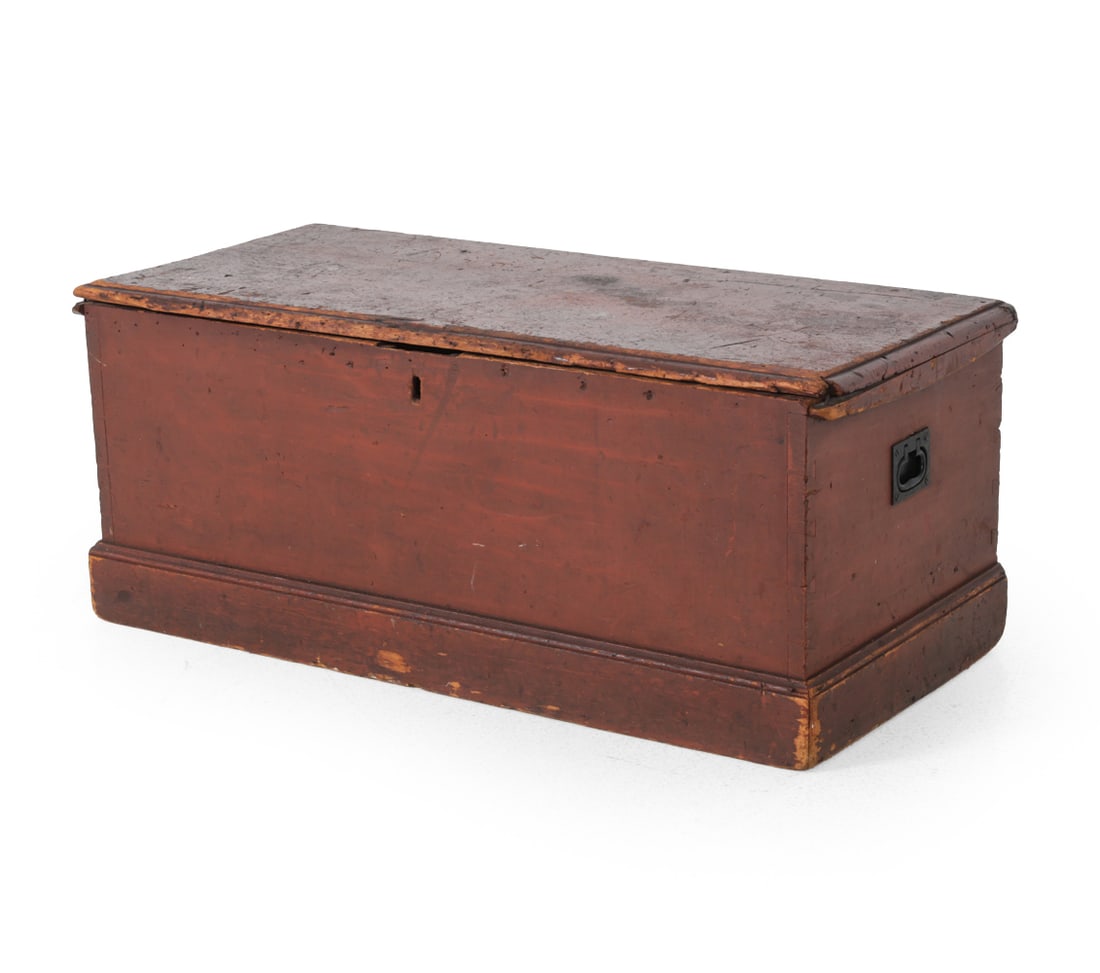 19TH C. PINE BLANKET CHEST W/ RED PAINT: Red finished pine chest with iron handles. 19th century. Dimensions: H 17'' x W 38'' x D 17'' Condition: Discoloration. Some scratches. Sun faded. Chipped at base. losses. Wear consistent with age