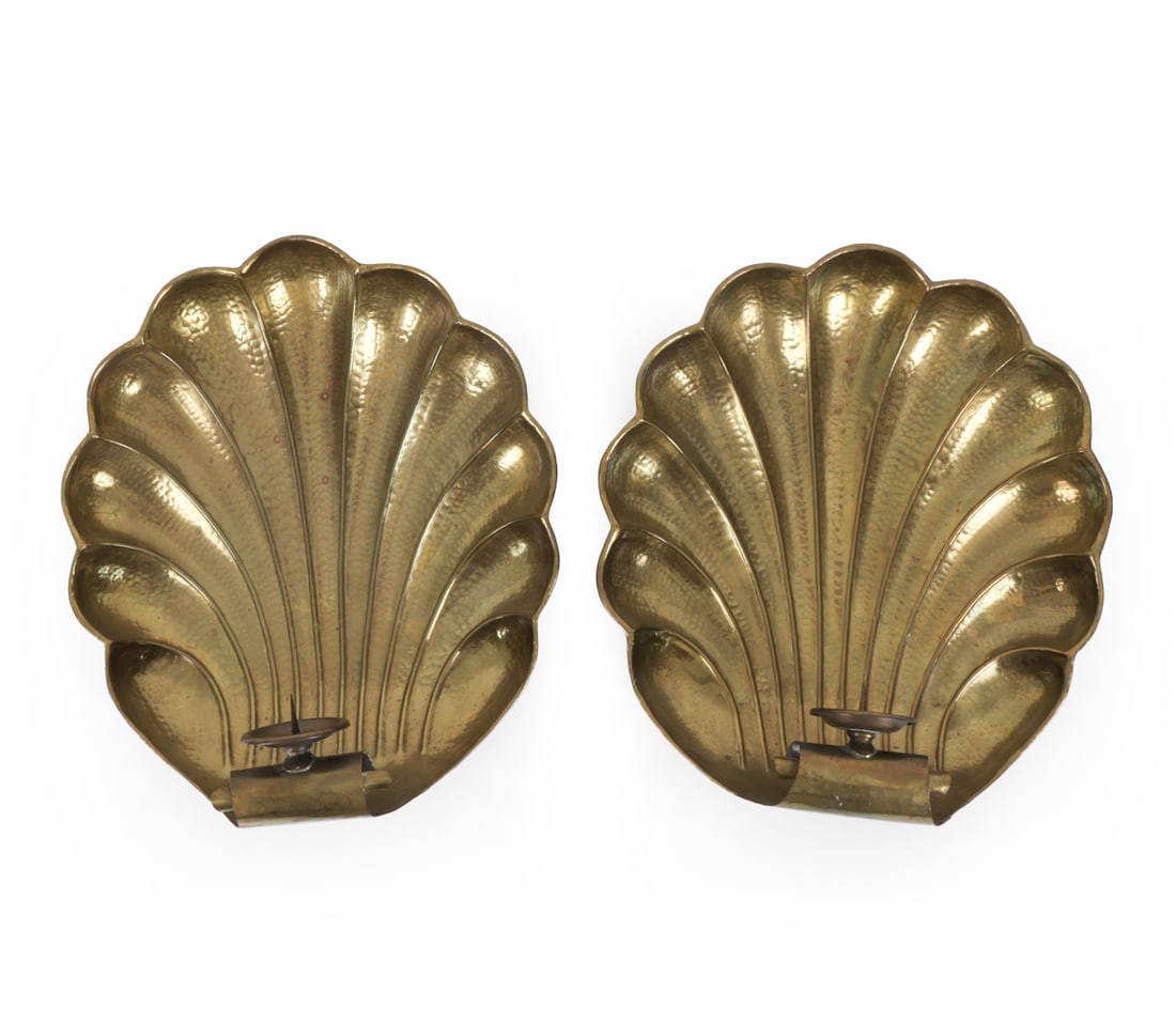 PAIR ITALIAN BRASS SHELL CANDLE WALL SCONCES: Hammered brass wall scones in the form of a scallop shell with a shaped outer edge. Marked " Made In Italy" verso. 20th Century. Dimensions: H 14.5 " x W 13.5 " x D 4.5 " Condition: Patina, nicks and 