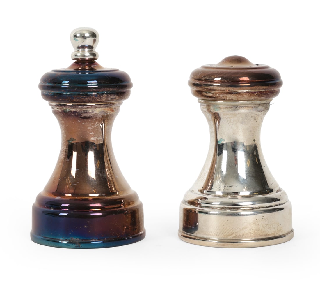 TIFFANY & CO. STERLING SALT & PEPPER SHAKERS: Tiffany and Co. sterling silver salt shaker and pepper mill, each with rounded form base. Marked "Tiffany & Co. 925 Italy, Made In Italy" Dimensions: (Tallest) H 3" x Dia 1.5" Condition: Tarnish to si