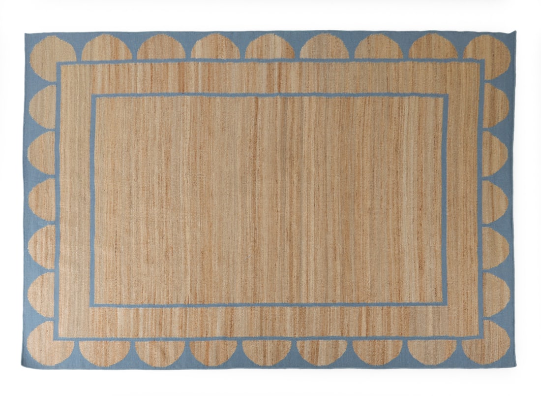 JAIPUR WITH LOVE JUTE WOOL WEDGEWOOD SCALLOPED RUG: Jute wool flat weave rug by manufacturer From Jaipur with Love. Features wedgewood blue scalloped and rectangular design. Dimensions: L 111" x W 145? Condition: Discoloration to surface. Wear consiste