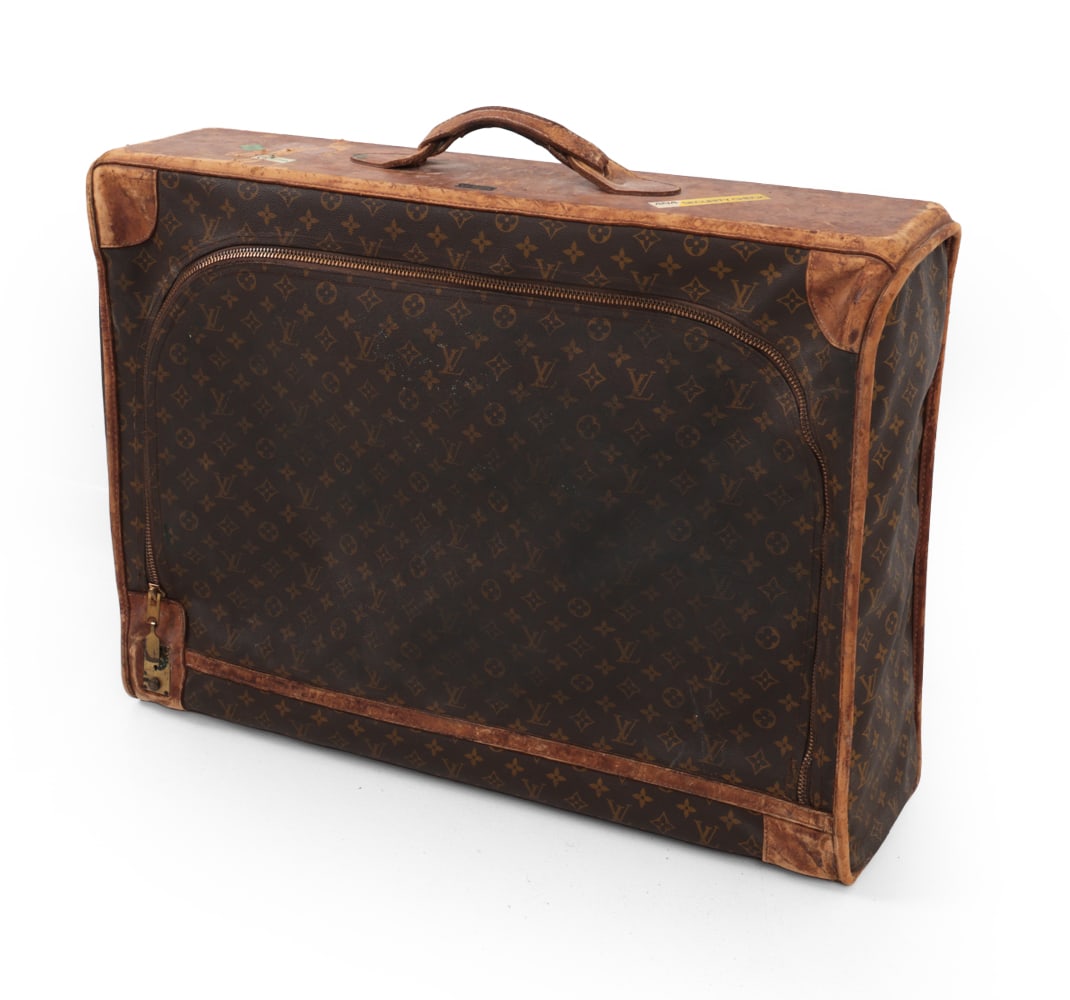 VINTAGE LOUIS VUITTON MONOGRAM SUITCASE: Vintage Louis Vuitton monogram canvas suitcase. Dimensions: H 24" x W 29" D 9.5" Condition: Heavy Wear to leather, stains and discoloration. Wear consistent with age and use.