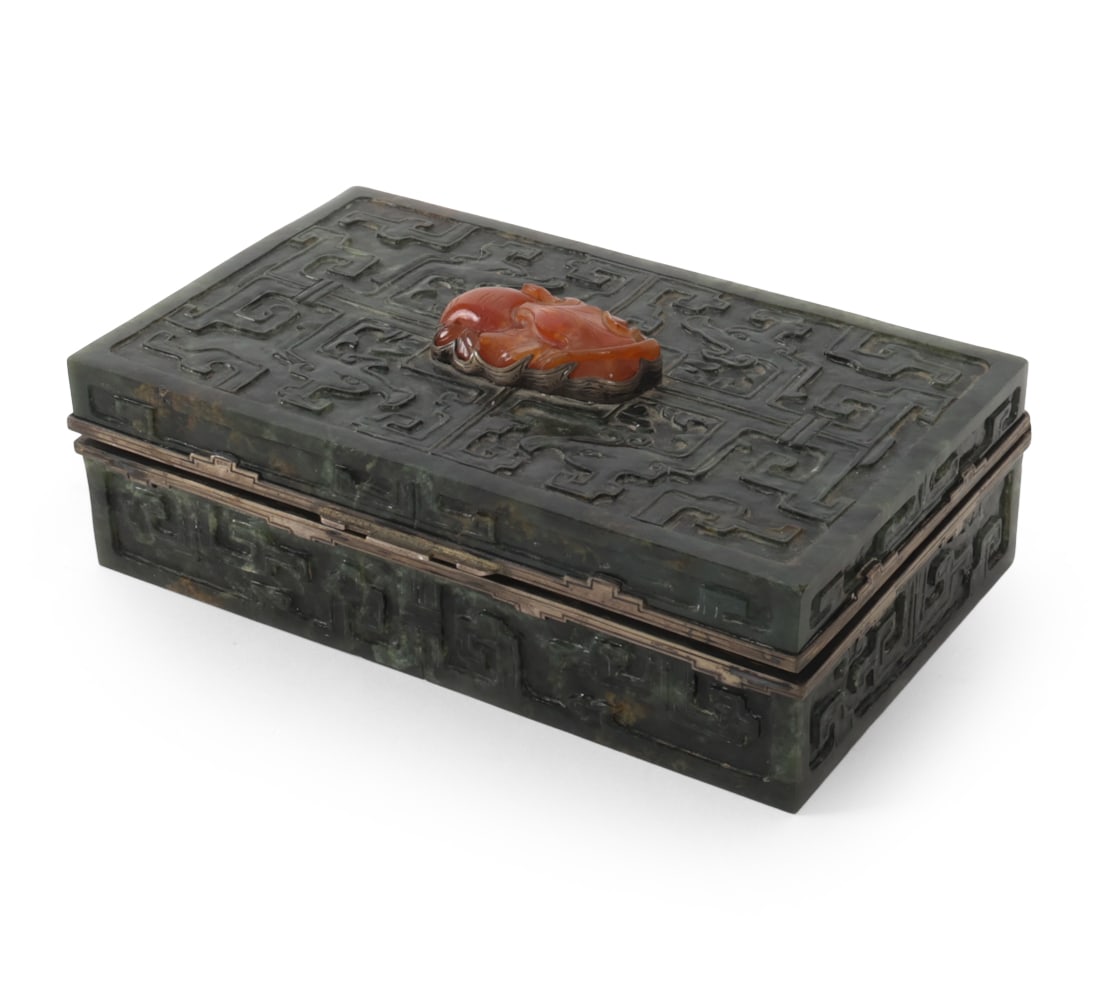 EDWARD FARMER CHINESE JADE DRESSER BOX: Chinese carved jade dresser box with geometric decoration and carved Agate finial to lid. Sterling silver mounted rim stamped "Sterling Edward L. Farmer Inc" Dimensions: H 2" X W 6.5" X " D 4"