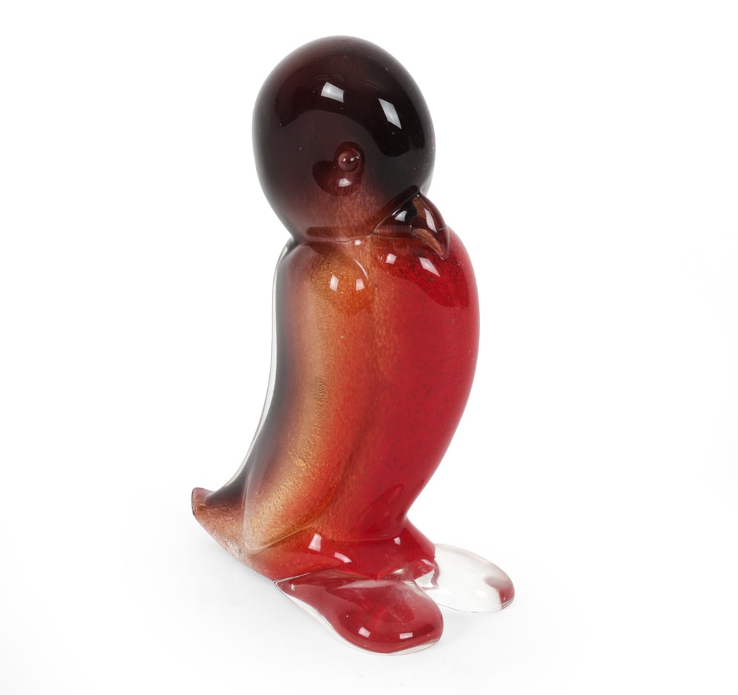 ARCHIMEDE SEGUSO ART GLASS PENGUIN SCULPTURE: Hand blown Murano art glass sculpture executed in the Sommerso technique with layered ruby red, amber and clear glass. Labeled on side and underneath, Made in Italy. Provenance: Originally purchased