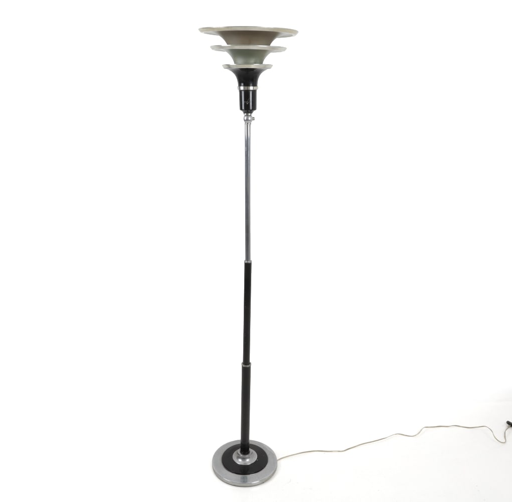 ART DECO MACHINE AGE TORCHIERE FLOOR LAMP C. 1930S: Tiered metal shade with adjustable chrome and black-finished metal base. Circa 1930s. Dimensions: H 68" x W 13" Condition: Patina to metal, light discoloration, and scuffs. chipping to black paint, Wi