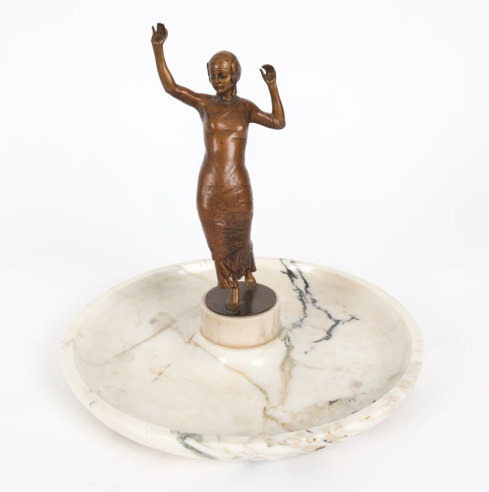 ART DECO BRONZE AND MARBLE SCULPTURE: Art deco style bronze dancer modeled as a female figure, mounted on a circular marble base. 20th Century Dimensions: H 12" x Dia. 12.75" Condition: Showing signs of wear including few tiny chips to ed