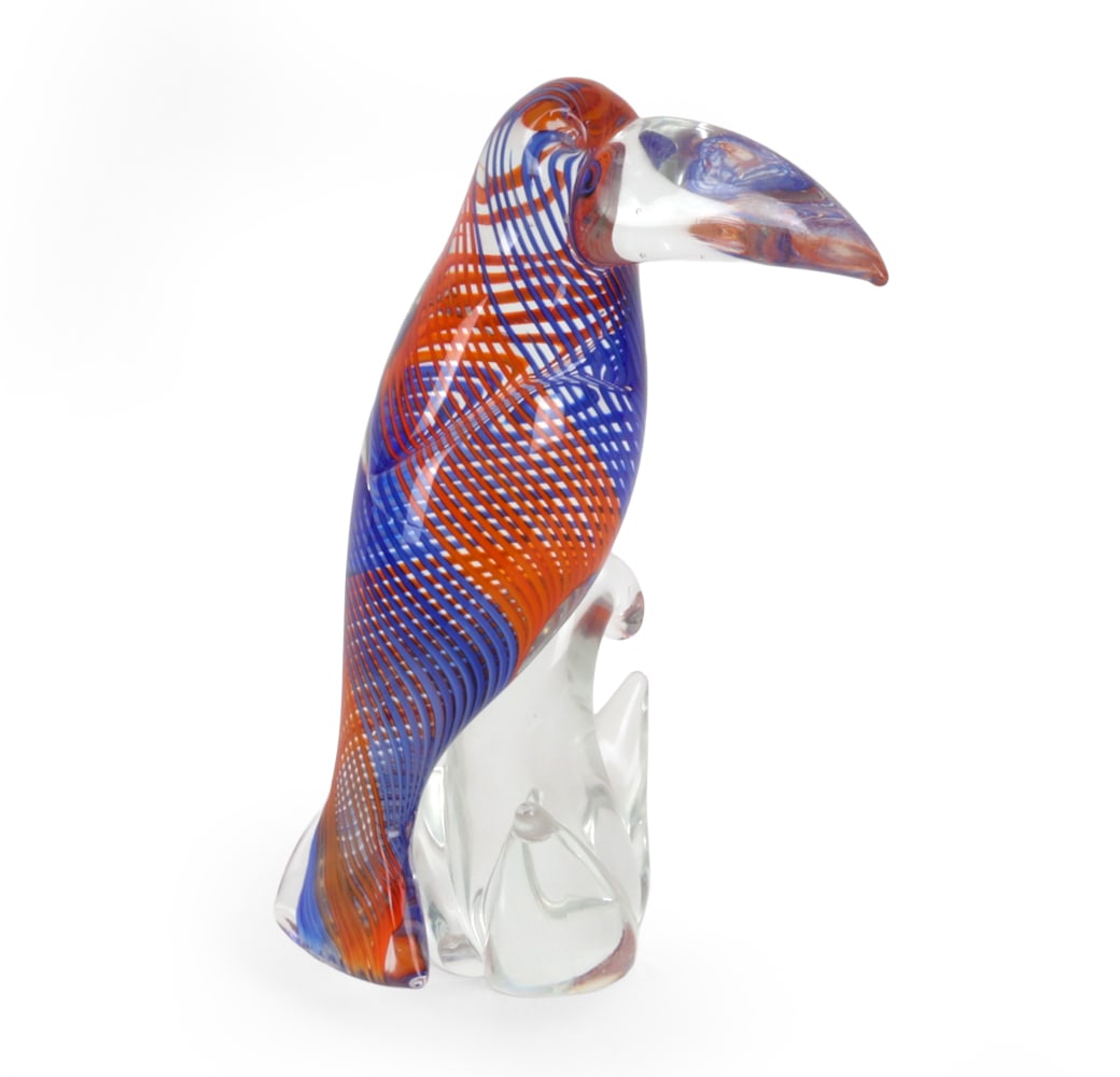MURANO ART GLASS TOUCAN SCULPTURE: Hand blown Murano Art glass toucan sculpture featuring red and cobalt blue cane decoration. Dimensions: H 10.5" x W 7" x D 4.5" Condition: Very light handling wear consistent with age.