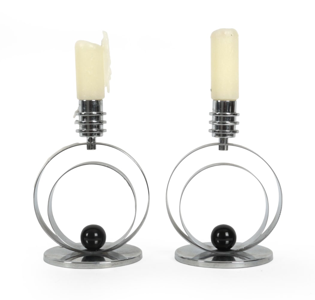 PAIR OF ART DECO CHROME CANDLEHOLDERS: Pair of chrome concentric circle candle holders with black sphere detail. Circa 1930s Dimensions: H 7" x W 5.25" x D 4.5" Condition: Wax, scratches, scuffs, and oxidation. Wear consistent with age and