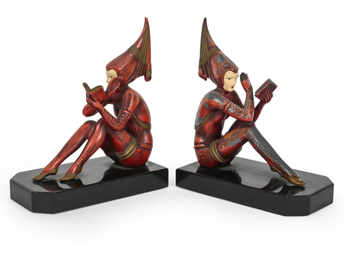 J.B. HIRSCH GERDAGO PIXIE LADY ART DECO BOOKENDS: Cold painted white metal figures seated on a black stone base. Attributed to Gerda Gerdago's "Contemplar" design for J. B. Hirsch Figure Company. Circa. 1920s. Dimensions: H 8" x W 7 '' Condition: Scu