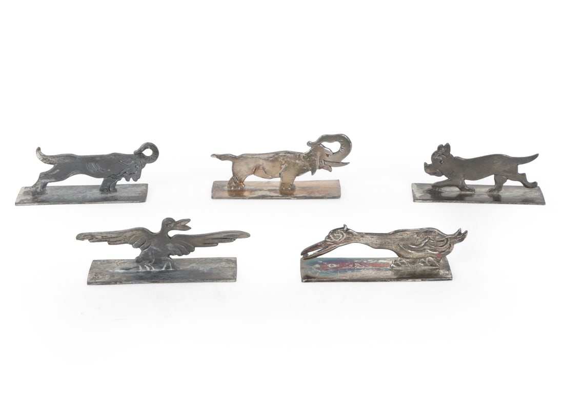 STYLE OF BENJAMIN RABIER SILVER PLATED KNIFE RESTS: (5) Total. Includes elephant, ram, dog, waterfowl and eagle. Indistinctly marked on base. Dimensions: (Largest) H 1.5" x W 3.5" x D 1" Condition: Tarnish to silver plating. Wear consistent with use an