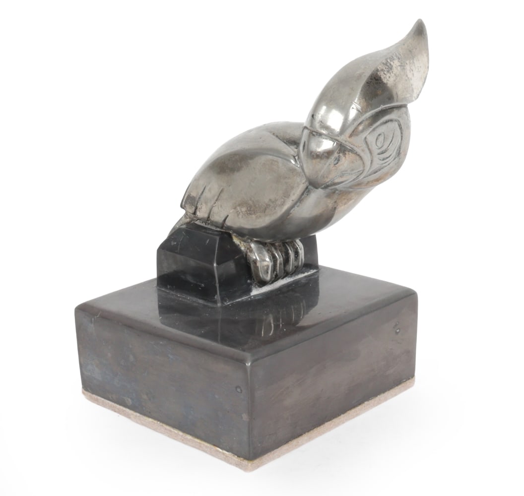 ART DECO CUBIST COCKATOO SCULPTURE 1930S: Nickel plated white metal cockatoo on base. Circa 1930s. Dimensions: H 6.5" x W 4.5" x D 4.25" Condition: Patina to nickel. Cockatoo loose from base. Wear consistent with age.