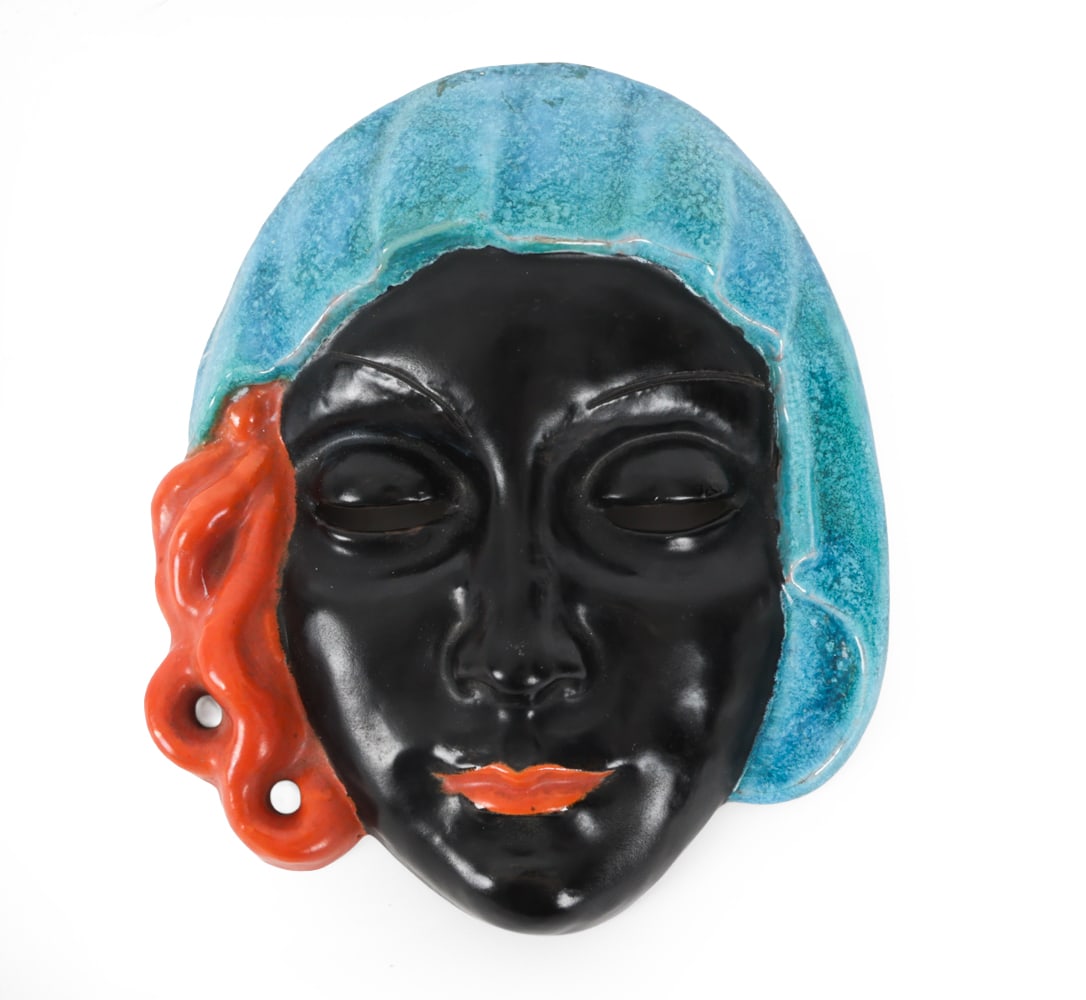 EMILIE SCHLEISS-SIMANDL CERAMIC WALL MASK: Hand painted ceramic wall mask by Emilie Schleiss-Simandl (Austrian, 1880-1962). Initialed verso "E.S" and number 7067. Dimensions: H 6.5" x W 5.5" x D 1.5" Condition: Wear consistent with age, includ