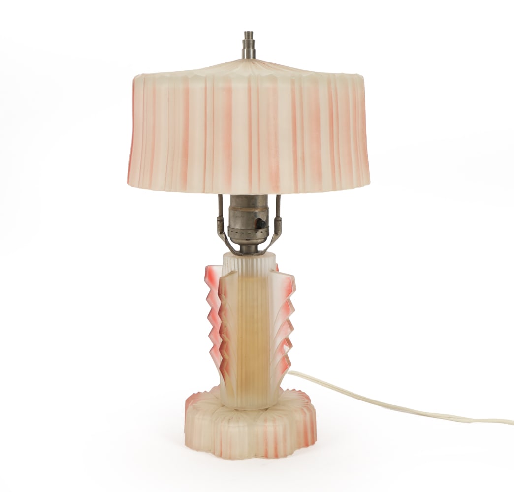 ART DECO GLASS BOUDOIR LAMP C. 1930s: Art Deco boudoir lamp with frosted pink and white satin glass. Circa 1930s. Dimensions: H 13.5" x Dia. 8" Condition: Oxidation to metal. Chips and fleabites to glass. Color losses. Wear consistent wit