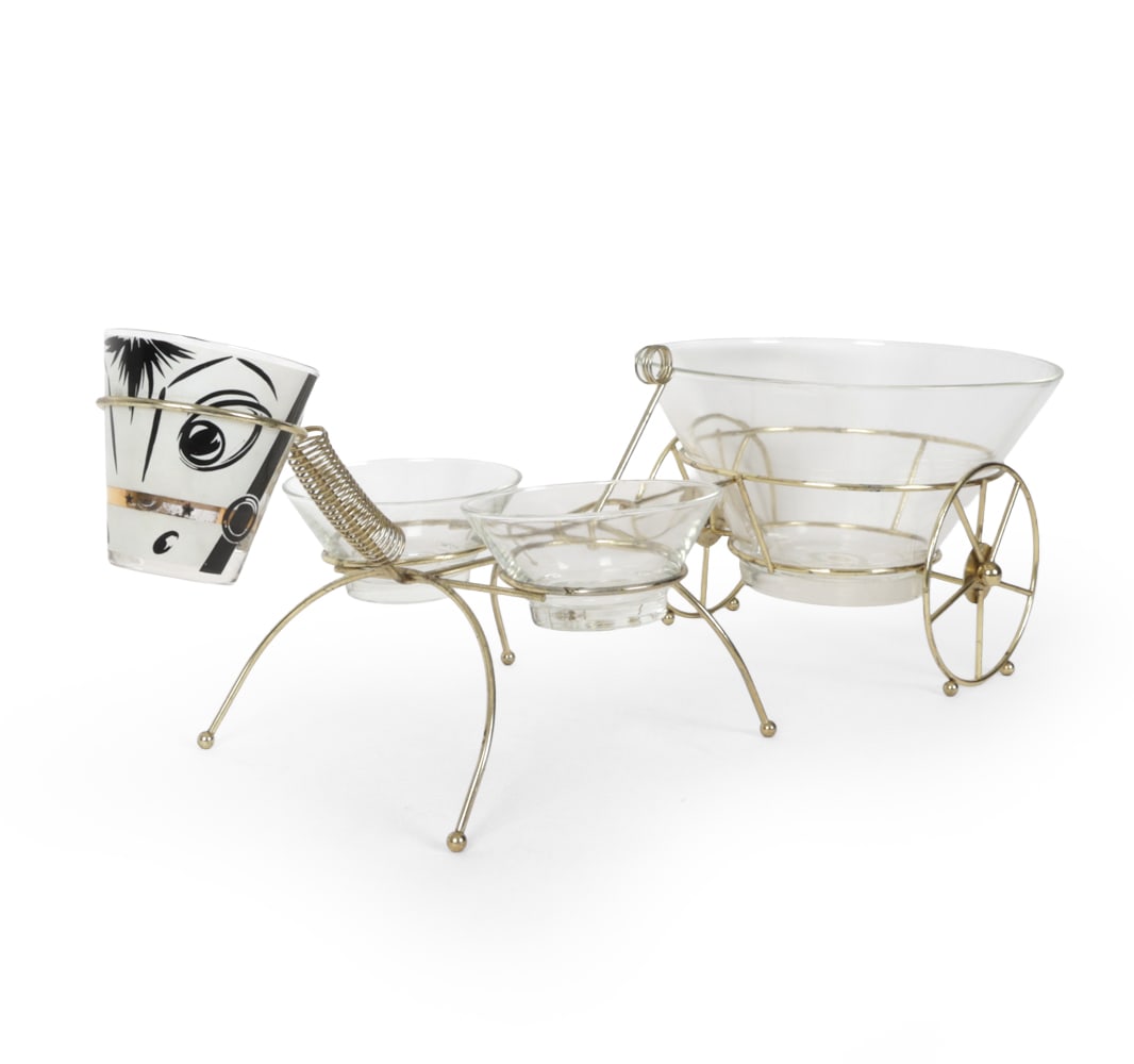 GAY FAD "HORACE DONKEY" CHIP & DIP SET C. 1950S: Includes large serving bowl, pair of glass bowls, painted donkey face cup, steel donkey body, steel cart frame. Brass plated steel and glass. "Gay Fad" marked on cup. Dimensions: H 27" x W 11" x D9.5"