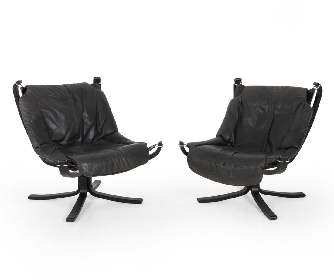 PAIR SIGURD RUSSEL FALCON LEATHER LOUNGE CHAIRS: Pair of leather and beech lounge chairs. Scandinavian. Circa 1970s. Dimensions: H 32.5" x W 30.5" x D 28.5" x SH 14" Condition: Odor present. could use cleaning Scuffs and paint losses to wood. Discol