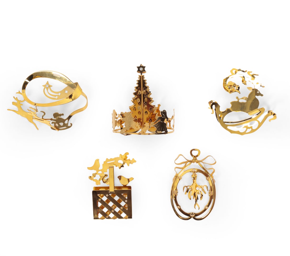 GROUPING JENSEN DANISH GOLD PLATED ORNAMENTS: (5) Total. Includes birds with basket, Santa and reindeer, mistletoe, reindeer and Christmas tree. Designed by Georg Jensen. Gold plated Christmas ornaments in cases. Danish. Circa 1980s and 1990s. Di