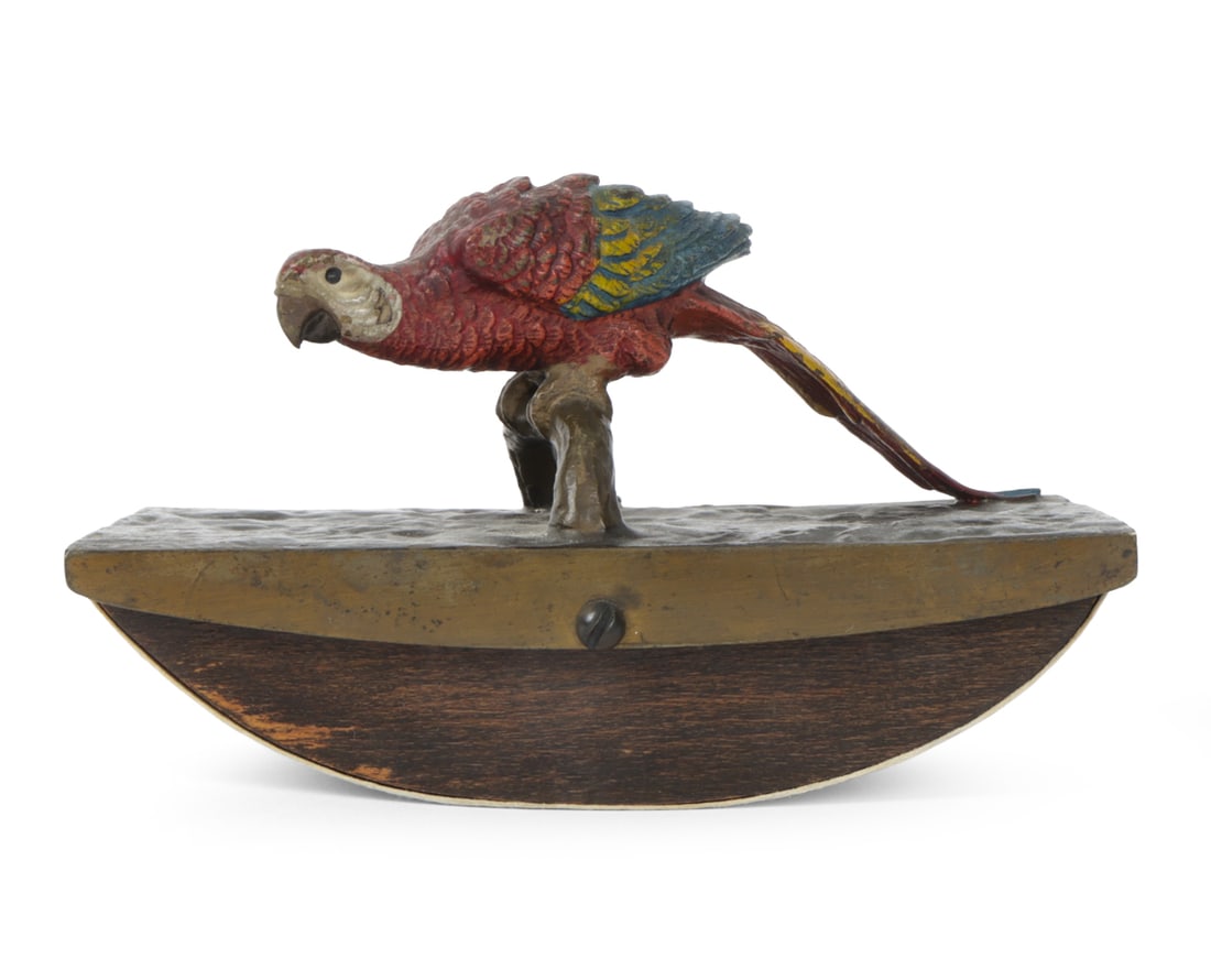 ANTIQUE VIENNA BRONZE PARROT ROCKING INK BLOTTER: Austrian cold painted bronze parrot on faux bois stand with wooden rocking ink blotter attached. Provenance: Originally purchased in 1995. Dimensions: H 3.5 " x W 5.25 " x D 2.5" Condition: Patina to