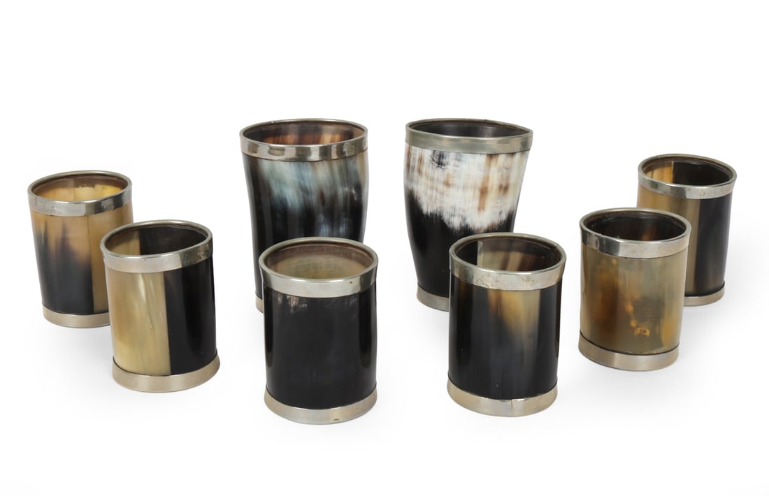 SILVER-RIMMED HORN CUPS GROUPING: (8) Horn cups with silverplate rim, crafted from bovine horn. Dimensions: (Tallest) H 3.5" x D 2.5" Condition: Wear consistent with age and use. Scuffs, rubs, minor tarnishing.
