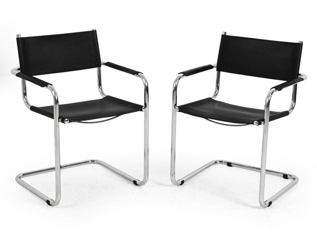 PAIR MART STAM STYLE CHROME CANTILEVER CHAIRS: Pair of tubular chrome plated steel and faux leather cantilever chairs. "Made in Italy" marked to bottom. In the style of Mart Stam's "Fasem Cantilever Leather chair." 20th century. Dimensions: H 31.5