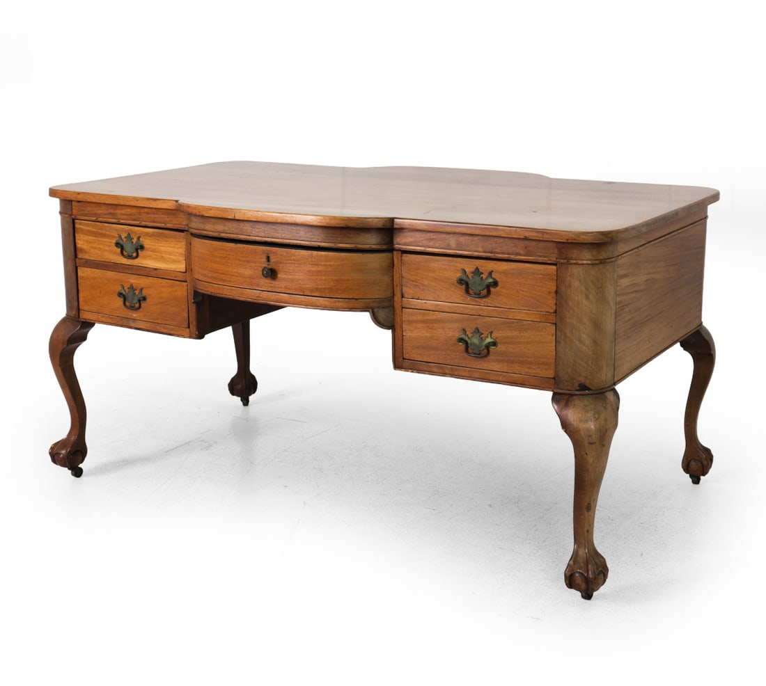 QUEEN ANNE STYLE MAHOGANY PARTNERS DESK: With drawers/workspace on both sides and carved legs with feet. England, circa 19th century. Dimensions: H 31" x W 61" x D 38" Condition: Sun fading to finish. Watermarks, wear consistent with age and