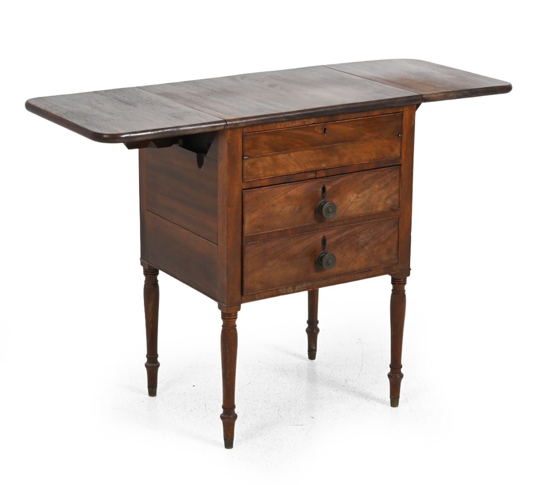 19TH C. REGENCY STYLE MAHOGANY SIDE TABLE: Drop leaf extendable top with turned legs, 19th century. Dimensions: H 29" x W 21" x D 16'' Condition: No key included. Discoloration, watermarks, wear of finish, and chips on front. Inside drawers