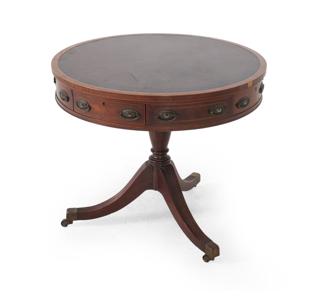 REGENCY STYLE MAHOGANY & LEATHER SIDE TABLE: Four drawers. Leather inlaid top. Brass hardware and casters. Dimensions: H 28 '' x Dia. 32'' Condition: Wear consistent to age and use. Key not included. Finish loss. Scuffs, staining, watermarks,