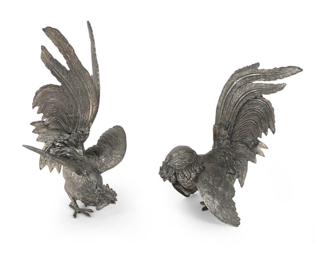 SILVERPLATE ROOSTER SCULPTURES: Two silverplated fighting roosters. Dimensions: H 11" x W 7" x D 5.5" Condition: Tarnish to plate finish. Wear consistent with age. Some scuffs.