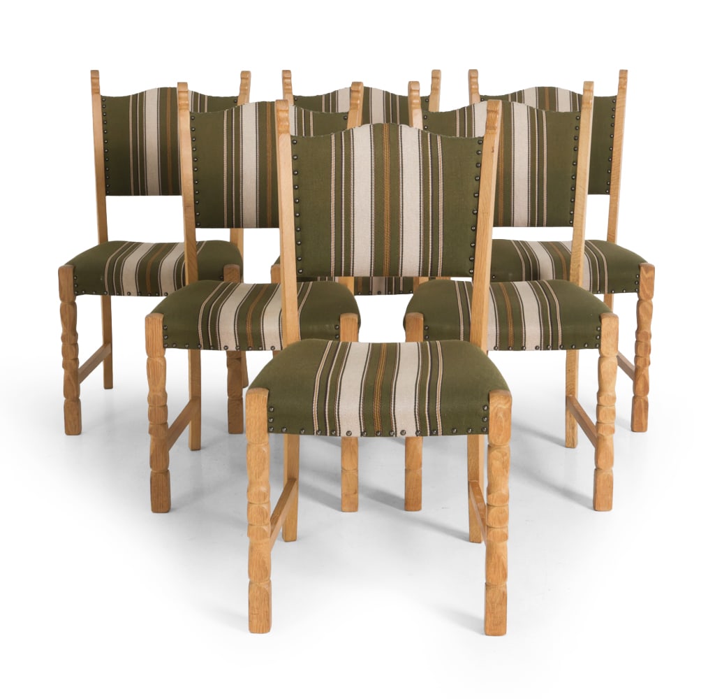 (6) STYLE OF KJAERNULF DANISH OAK DINING CHAIRS: Oak frame with striped upholstery and nail head trim. Denmark, circa 1970s. Dimensions: H 36" x W 16.5" x D 17" x SH 17" Condition: Scuffs and fading. Discolored areas to frame. Wear consistent with