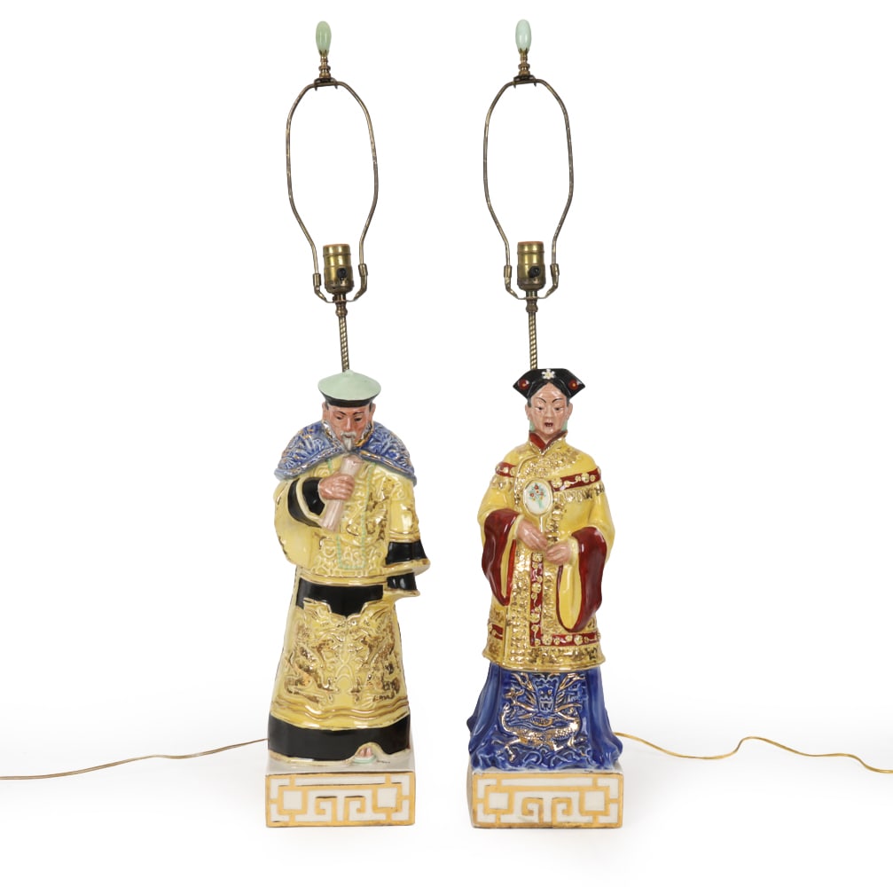 PAIR ITALIAN CHINOISERIE EMPEROR & EMPRESS LAMPS: Hand-painted porcelain lamps with gilded details. Marked with "Gioia", Italy. Dimensions: H 36.5 " x W 6.75" D 8.5" Condition: Loss of gold leaf finish on ceramic, wire untested. Wear consistent with