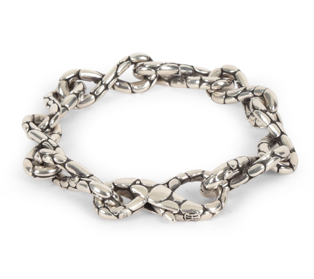 JOHN HARDY KALI SILVER KALI TWIST BRACELET: John Hardy Kali collection sterling silver link bracelet with pebbled oval links and oxidized recesses, Stamped 925 with designer signature on clasp. Dimensions: L 7.75" Weight: 1.485 ozt. Condition: