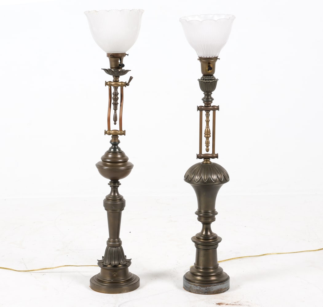 (2) NEOCLASICAL STYLE ADJUSTABLE BRASS DESK LAMPS: With ribbed floral-inspired glass shades. Bronze-toned finish. Mid 20th century. Dimensions: Tallest H 35.75" x Dia. 7.5". Condition: Wiring untested. Minor surface soiling, some small nicks and scuff