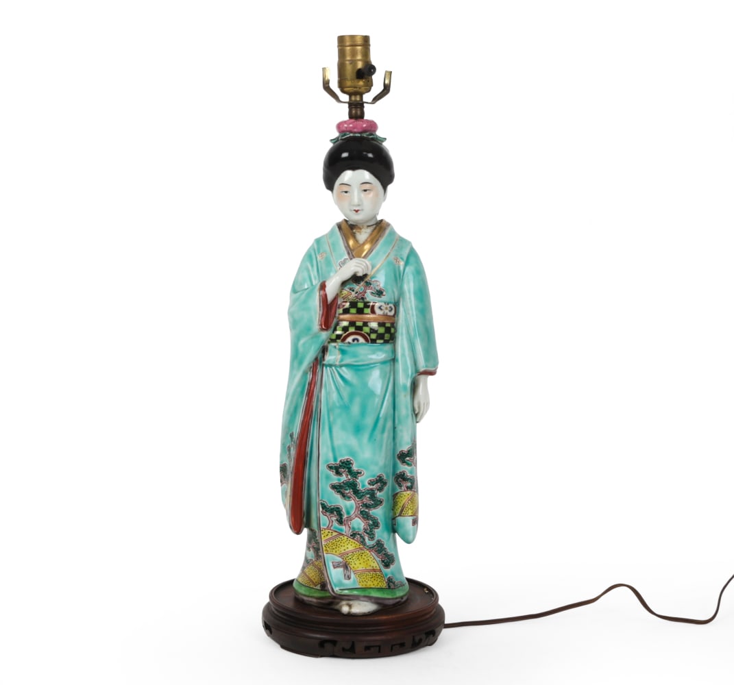 JAPANESE PORCELAIN GEISHA TABLE LAMP: Porcelain with gilded details and carved wood base. Dimensions: H 23.5 " x W 7 " x D 7 ? Condition: break and repair to figures head, loss to ceramic on neck, previous repairs to wooden base, wiring u