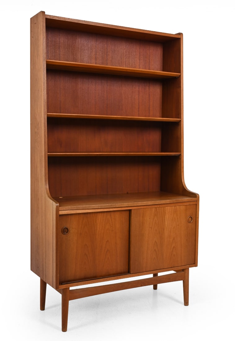 JOHANNES SORTH FOR NEXO TEAK BOOKCASE C. 1960S: Sliding doors at bottom with adjustable interior shelves. Backside with stamped serial numbers and dated 1965.Dimensions: H 71.75" x W 39.75" x D 17"Condition: Fading and discoloration. Chips/losses t