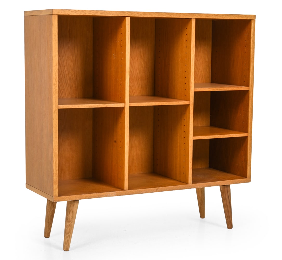 BJERRINGBRO DANISH TEAK BOOKCASE C. 1960S: Bookcase with open divided shelving by Bjerringbro Kontormobler. Marked to back. Denmark, circa 1960s. Dimensions: H 37" x W 36.5" x D 12.25" Condition: Scuffs, scrapes, discoloration and fading to to