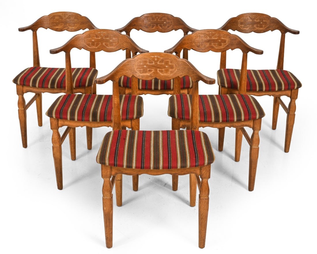 (6) HENNING KJAERNULF OAK VIKING DINING CHAIRS: Kjaernulf for EG Mobler, Carved geometric back and striped upholstery. Denmark, circa 1960s. Dimensions: H 30.5'' x W 21'' x D 18" S.H. 18" Condition: Showing signs of wear including soiling to wood f